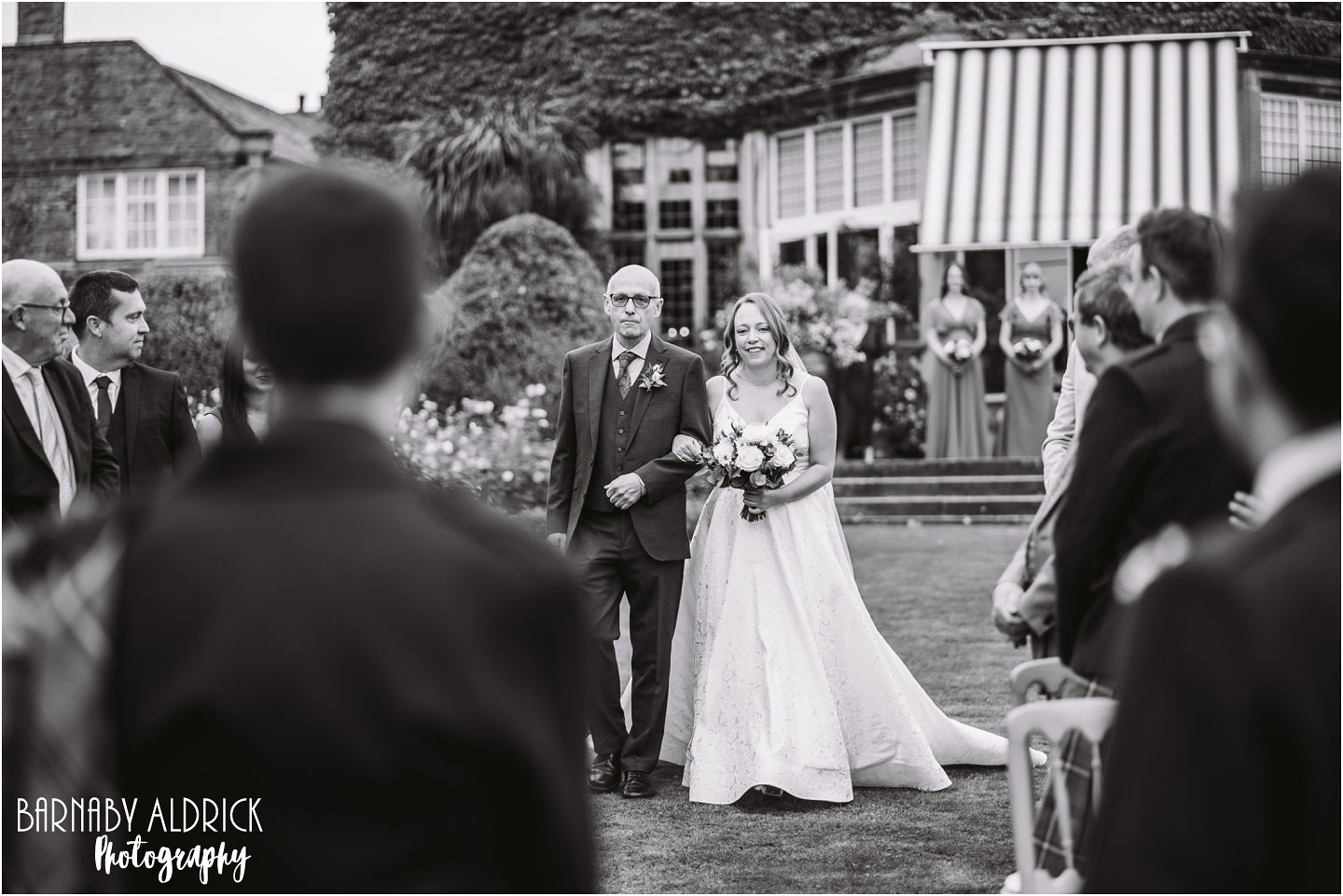 Outdoor ceremony with tartan kilts at Goldsborough Hall in Yorkshire