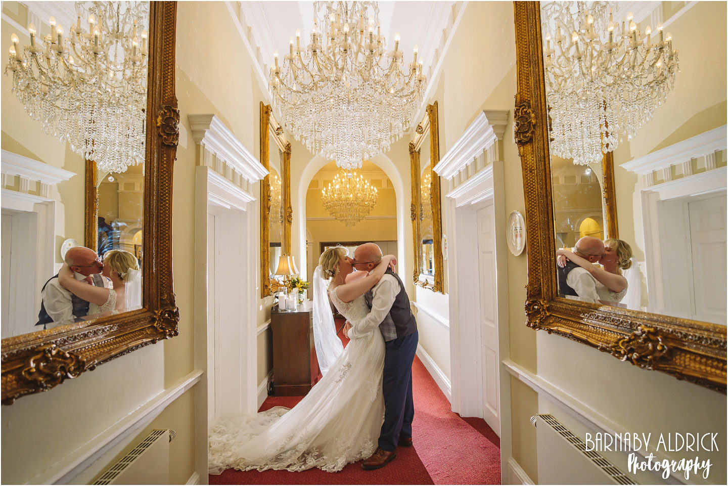 Goldsborough Hall chandelier wedding couple photographs near Knaresborough and Harrogate in Yorkshire by Barnaby Aldrick Wedding Photography