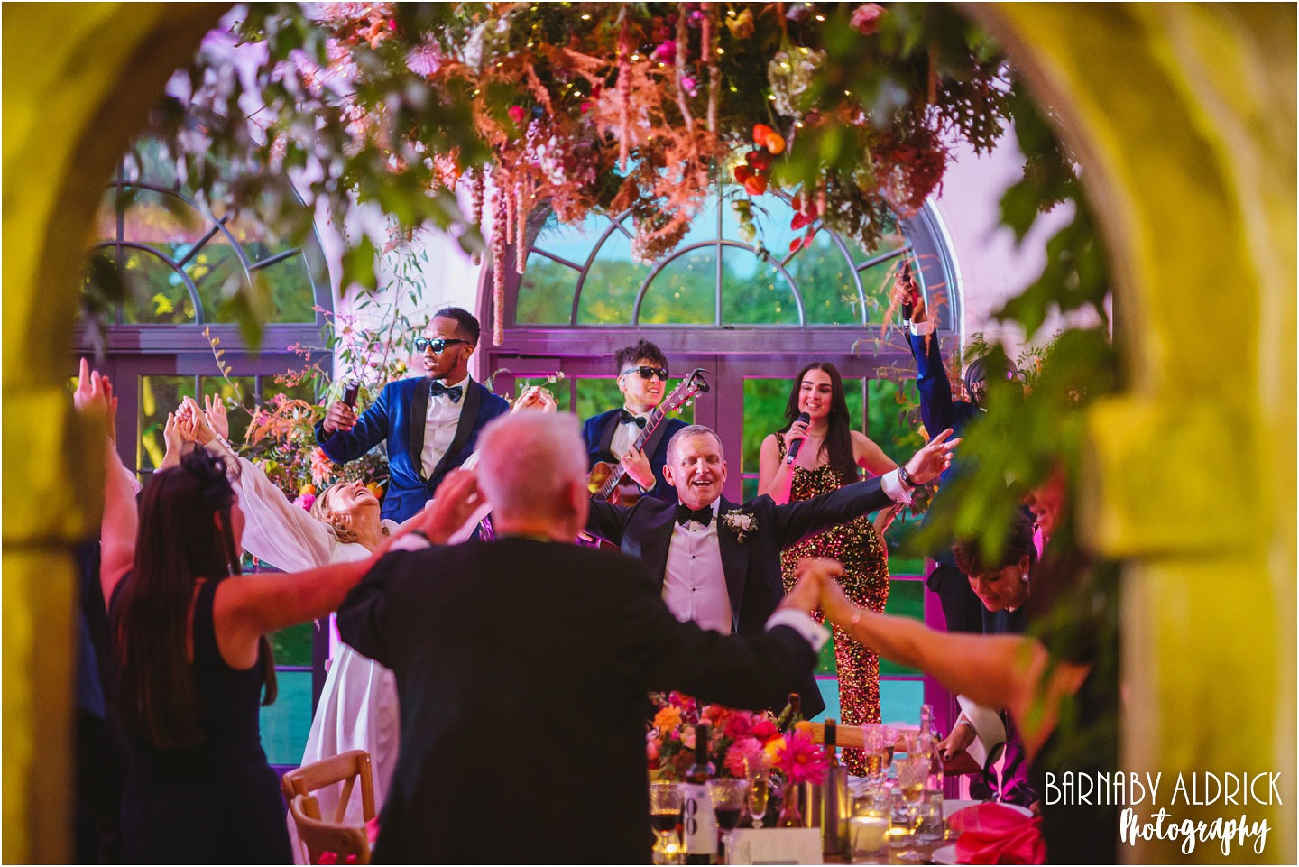 The Function band entertain wedding guests in the Fig House at Middleton Lodge in Yorkshire