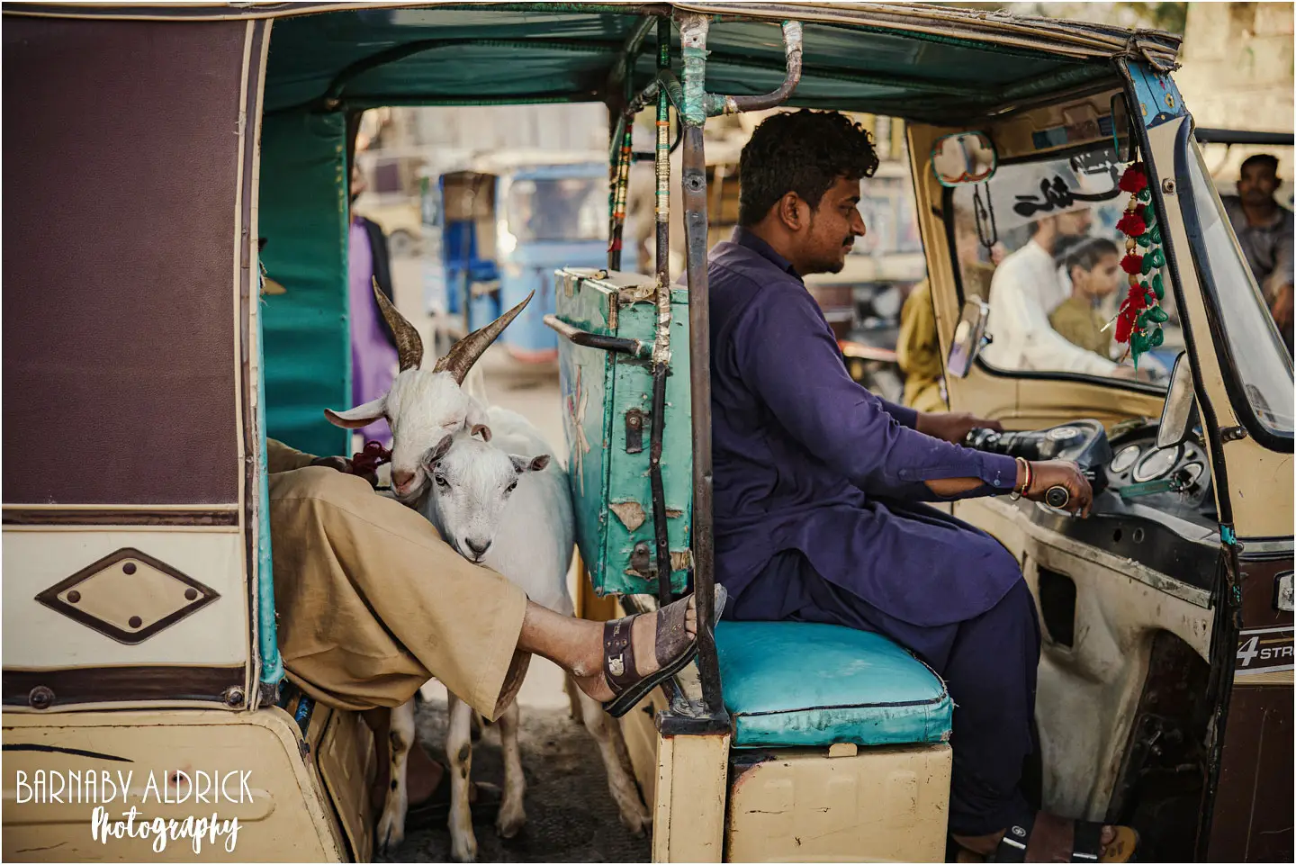 Goats in Tuk tuk at Lalukhait Sunday market in Karachi Pakistan