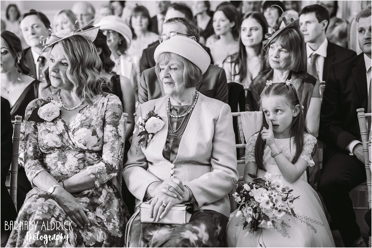 Fun wedding photography, flower girl picking her nose