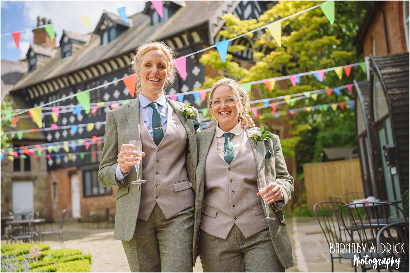 Bethan + Karla's colourful same sex wedding photos at Samlesbury Hall near Preston in Lancashire by Photographer Barnaby Aldrick