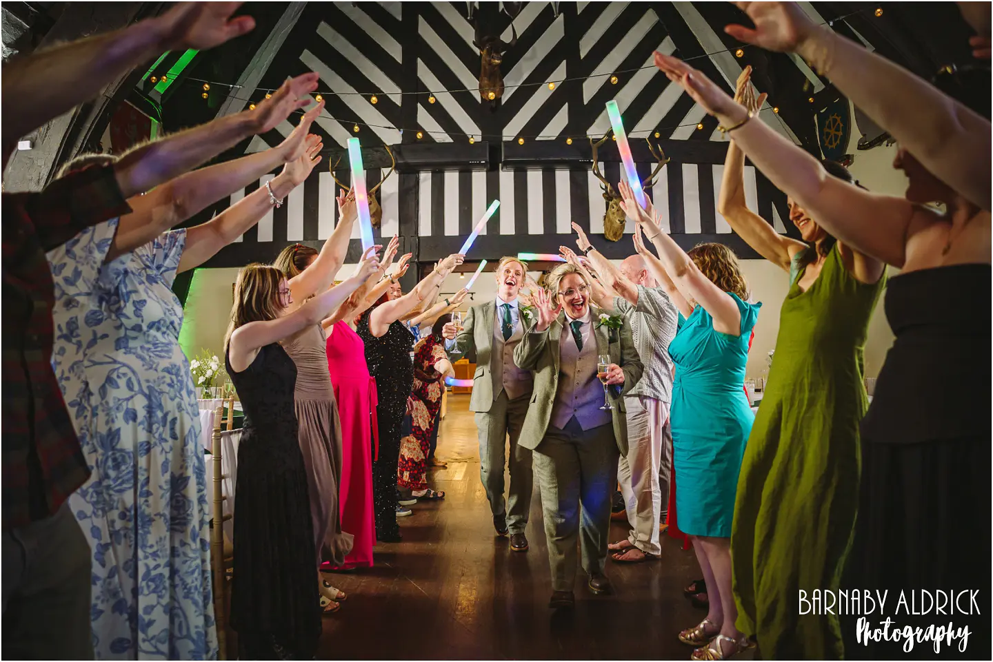 A fun guard of honour tunnel entry into the great hall at Samlesbury Hall near Preston in Lancashire