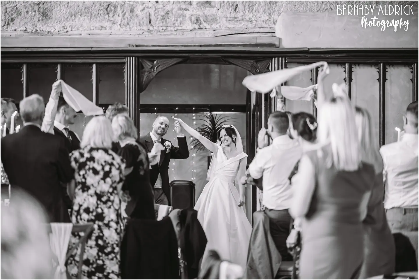 Couples entrance wedding photo into the meal at the Priests House in the Yorkshire Dales