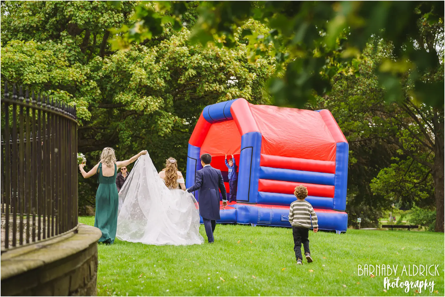 Spontaneous bouncy castle at a wedding at the mansion in Roundhay Park in Leeds Yorkshire