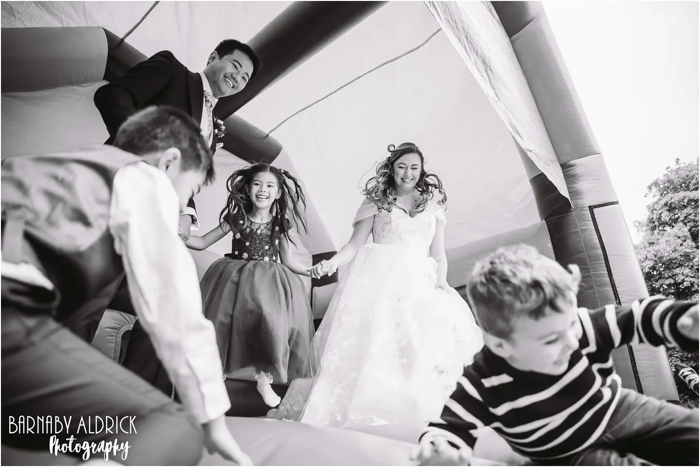 Fun bouncy castle wedding photos at the mansion in Leeds